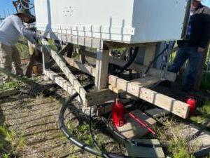 Stabilizing the tuning cabinet at the base of the East Tower